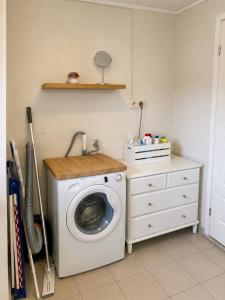 a laundry room with a washing machine in it at Apartment Mandal in Mandal