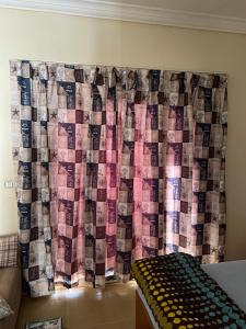 a room with a curtain covered in money at La sirena double room with mountain view, Families and couples only, Extra of 180 Egyptian pounds per adult person per stay ,to be paid to the resort in Ain Sokhna