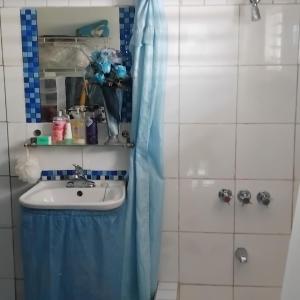 a bathroom with a sink and a shower at Powell's guesthouse in Santa Cruz +17 photos