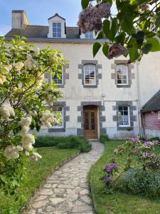 an old house with a stone path in front of it at Kerannie in Lanvollon