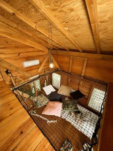 an overhead view of a hammock in a cabin at evasion guadeloupe in Malgré Tout