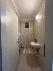 a bathroom with a toilet and a sink at Lale Residence in Trabzon