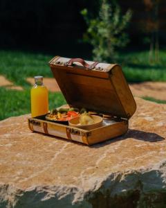 a box of food and a bottle of orange juice at Folià - Natural Experience in San Vito dei Normanni