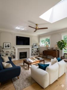 a living room with a couch and a fireplace at Northern Stay in North Vancouver