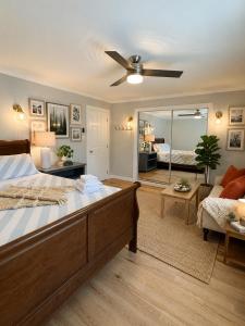 a bedroom with a large bed and a ceiling fan at Northern Stay in North Vancouver