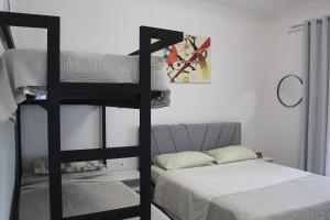 a bedroom with two bunk beds and a bed at Megan's Villa in Durrës