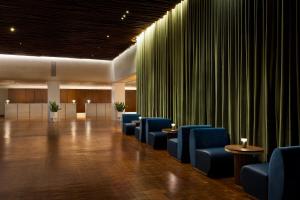 a conference room with blue chairs and green curtains at ROW NYC at Times Square in New York