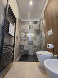 a bathroom with a toilet and a sink at Cà Fiamma 2 in Casale Monferrato +37 photos