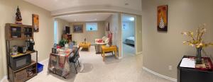 a living room with a couch and a room with a living room at Green House in St. John's