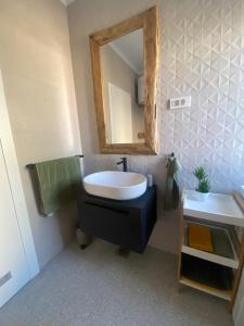 a bathroom with a sink and a mirror at Apartmany Vir DaRa in Vir +22 photos