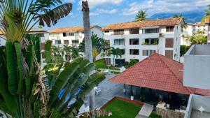 an aerial view of a building with a red roof at La Marina Condominiums by Monyxbnb in Puerto Vallarta