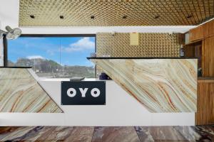 a room with a sign that says oo at Hotel O Dwarkadhish in Surat