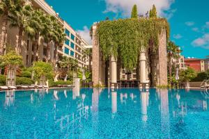 a large swimming pool in front of a building at Argisht Partez Hotel ALL INCLUSIVE & BEACH BAR REBLS in Golden Sands