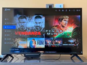 a computer monitor with a bunch of movies on it at Departamento Blanco Encalada in Temuco