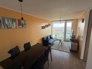 a living room with a couch and a table at Departamento Blanco Encalada in Temuco