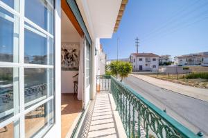 a balcony with a view of a street at Quinta da Mina 13 in Azambuja