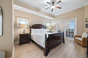 a bedroom with a bed and a ceiling fan at The Oasis at Orange Beach Unit 1816 in Orange Beach