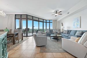 a living room with a couch and chairs and a table at The Oasis at Orange Beach Unit 1816 in Orange Beach