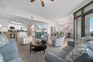 a living room with a couch and chairs and a table at The Oasis at Orange Beach Unit 1816 in Orange Beach +60 photos