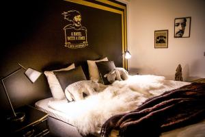 Postel nebo postele na pokoji v ubytování Boutique Hotel Mustaparta