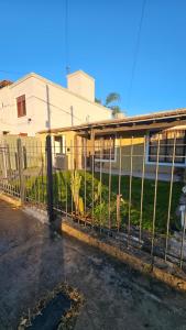 a metal fence in front of a building at Bell Ville in Bell Ville