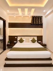 a bedroom with a large bed in a room at Hotel Pleasant Taj Agra -Budget Family AC Rooms in Tājganj +7 photos