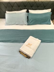 a white towel sitting on top of a bed at Y&S Residence in Olongapo +46 photos