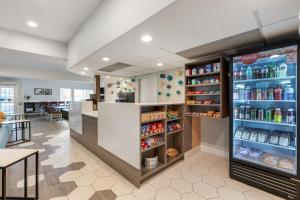 a fast food restaurant with a refrigerator filled with drinks at Best Western Plus Pioneer Park Inn in Fairbanks