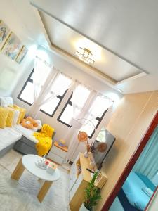 an overhead view of a living room with a couch at Y&S Residence in Olongapo