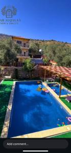 an image of a swimming pool at a resort at Bab al-qalaa farm & chalets مزرعة وشاليهات باب القلعه in Ajloun