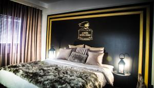Postel nebo postele na pokoji v ubytování Boutique Hotel Mustaparta