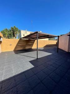 a pavilion with awning in a parking lot at Apartment 2 in Apóstoles +9 photos