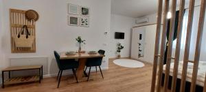 a room with a table and chairs and a bed at SIA Thermal Felix - Calm & Comfort near Apollo Thermal Bath in Baile Felix +13 photos