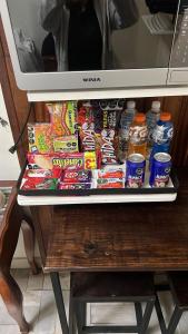 a refrigerator filled with lots of snacks and drinks at Habitación 4 Casa Minerva in Puebla +9 photos