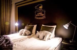 Postel nebo postele na pokoji v ubytování Boutique Hotel Mustaparta