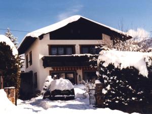 a house with snow on the roof of it at Veronika in Fulpmes