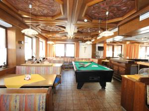 a billiard room with a pool table in a restaurant at Bergheimat S in Huben