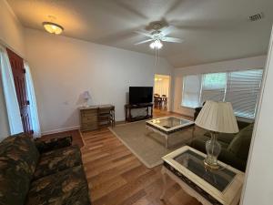 a living room with a couch and a table at House 210 Brunswick in Brunswick