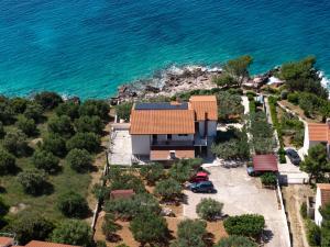 an aerial view of a house next to the ocean at Apartment Zavala 553d in Jelsa