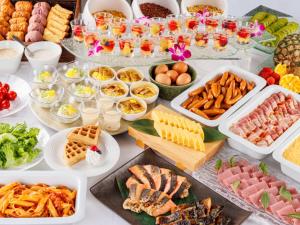 a table topped with lots of different types of food at Hotel Monterey Himeji in Himeji