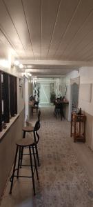 an empty room with a table and chairs in it at Teranga in Artigues