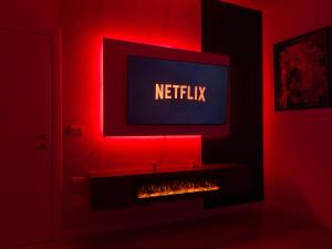 a living room with a tv and a fireplace at Boku Apartments Pazari i Ri 2 in Tirana