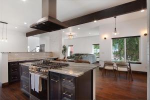 a kitchen with a stove and a counter top at Beautiful new home in Sanders Beach! in Coeur d'Alene