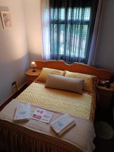 a bedroom with a bed with two towels on it at Acomodação-Viasoft-UP-Ecoville-INC-FioCruz-CIC in Curitiba