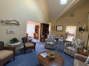 a living room with couches and chairs and a table at Spacious Home Bethany Beach in Frankford