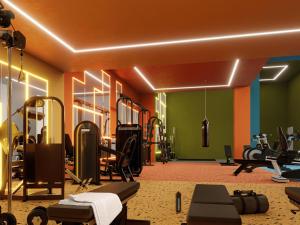 a gym with lots of equipment in a room at Deluxe Studio in Secrt Escalante AC in San Pedro