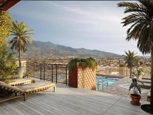 a balcony with benches and a view of a city at Deluxe Studio in Secrt Escalante AC in San Pedro