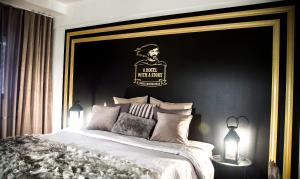 Postel nebo postele na pokoji v ubytování Boutique Hotel Mustaparta