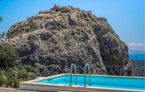 a swimming pool in front of a mountain at Prinos 3 in Agia Galini