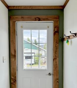 a door in a room with a window at Brooks Place in Deer Lake
